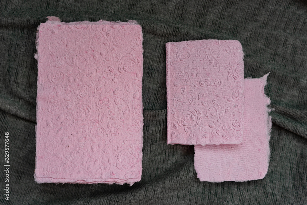 Fototapeta premium Handmade paper. A stack of texture paper. Concept of recycling used paper, ecology theme.
