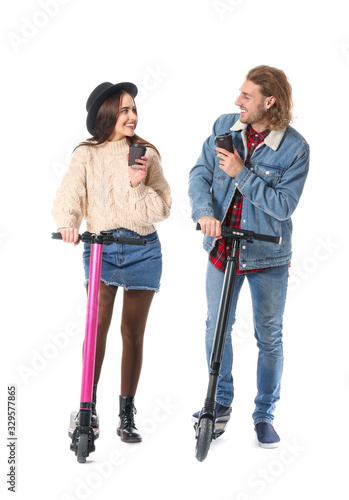 Young couple with kick scoo...