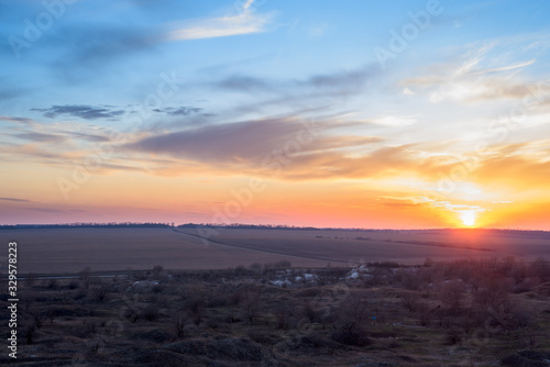 panorama of a blue-pink sunset with clouds of pink hues. sunset on the horizon. dramatic sky. photo for the banner. space for text.