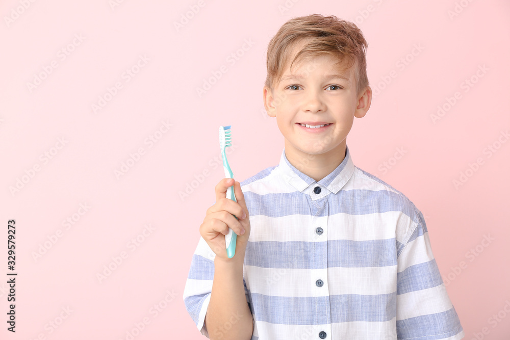 Cute little boy with toothbrush on color background Cute little boy with toothbrush on color background