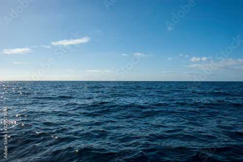 View of the sea horizon from the island of Tenerife. Texture of the sky and sea waves. A whale is hidden in the picture.