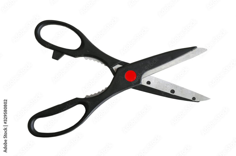 Black scissors. The object is isolated on a white background. Black scissors. The object is isolated on a white background.