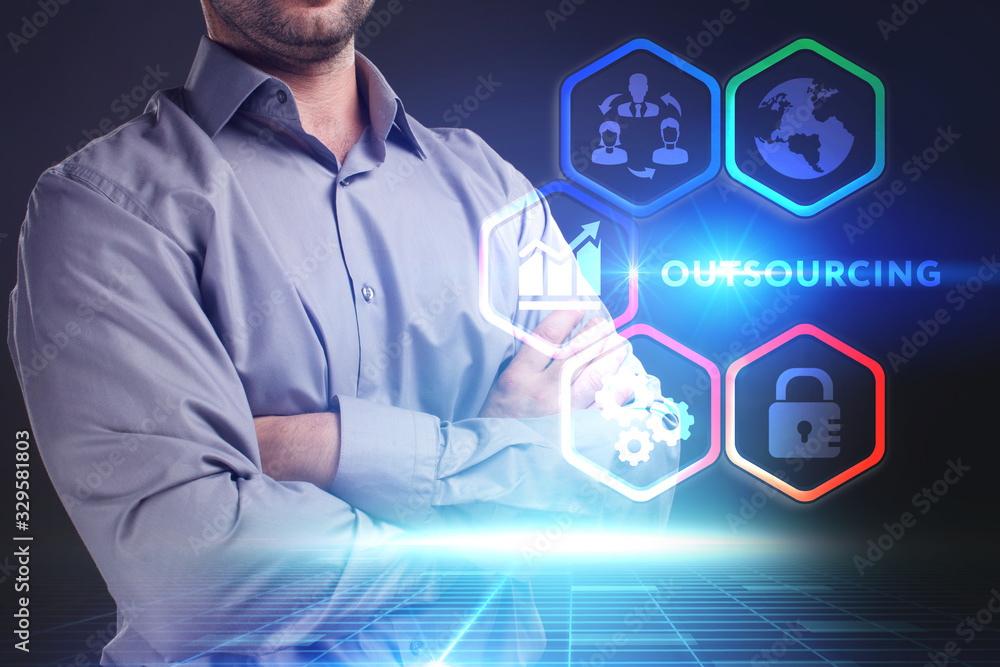 Business, Technology, Internet and network concept. Young businessman working on a virtual screen of the future and sees the inscription: Business, Technology, Internet and network concept. Young businessman working on a virtual screen of the future and sees the inscription: