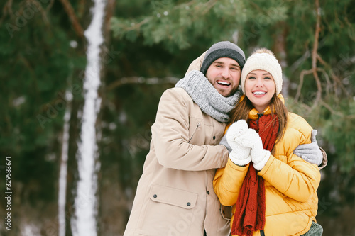 Happy young couple in park ...