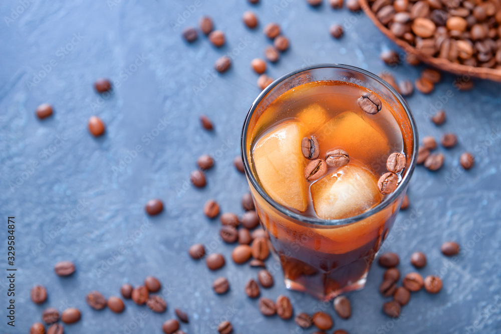 Glass of tasty iced coffee on dark background Glass of tasty iced coffee on dark background