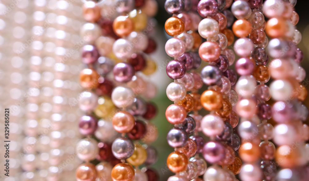 Pearl beads on a pink counter Pearl beads on a pink counter
