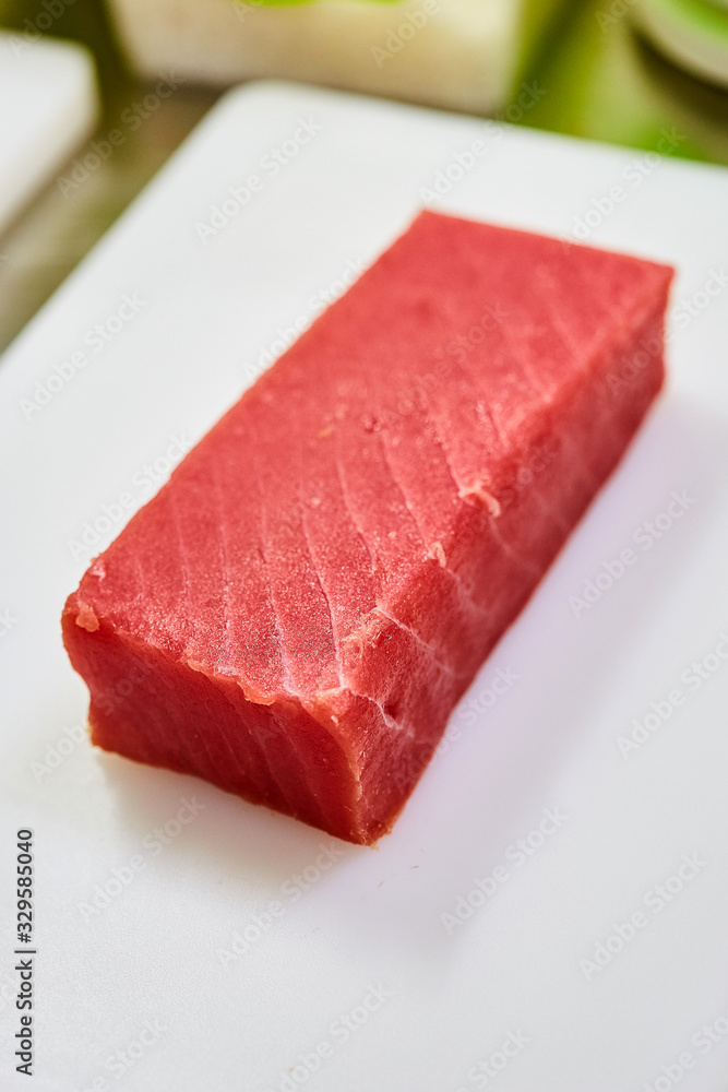 Steak of Tuna Fish Fillet on a cutting board - Fish and Seafood Steak of Tuna Fish Fillet on a cutting board - Fish and Seafood