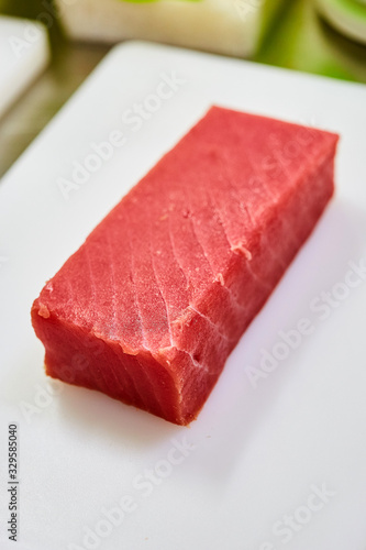 Steak of Tuna Fish Fillet on a cutting board - Fish and Seafood