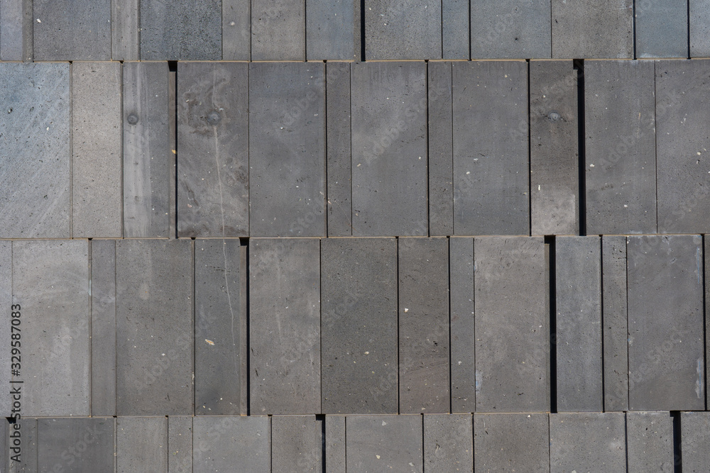 Gray wall. Stone tiles. Texture or background. Place for text. Gray wall. Stone tiles. Texture or background. Place for text.