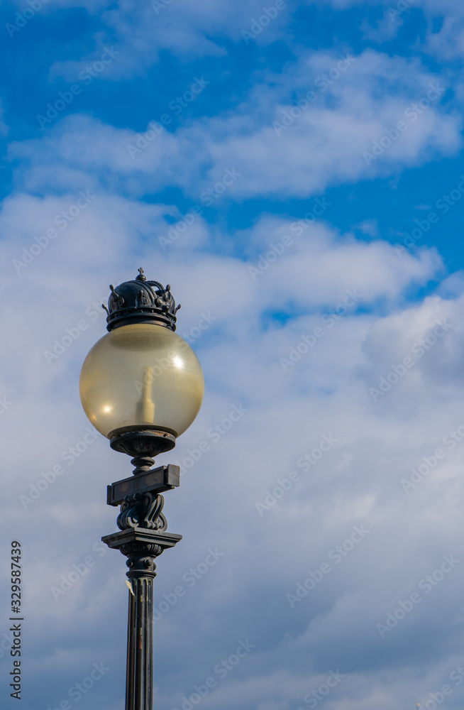 Street lamp in the background of spring sky. Vienna. Wien. Austria. Europe. Street lamp in the background of spring sky. Vienna. Wien. Austria. Europe.