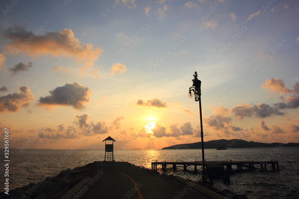 Fototapeta premium Small white house with morning on the sunset at Khao Laem Ya, Rayong ,Thailand.