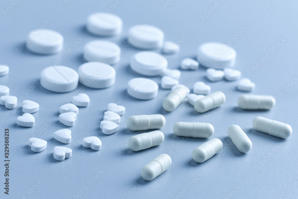 Closeup of many white tablets, pills Closeup of many white tablets, pills