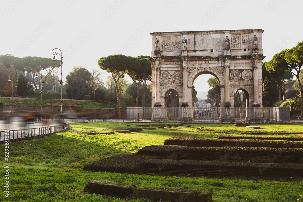 Fototapeta premium Arc di Trajan in Rome with tourists