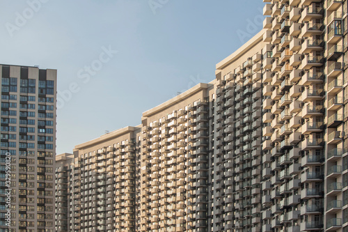 Modern and new apartment buildings. Multistoried modern, new and stylish living block of flats. Real estate. New house.Newly built block of flats