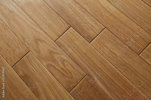 Natural wooden texture. New oak parquet. Wooden laminate floor boards background image. Polished oak pattern.