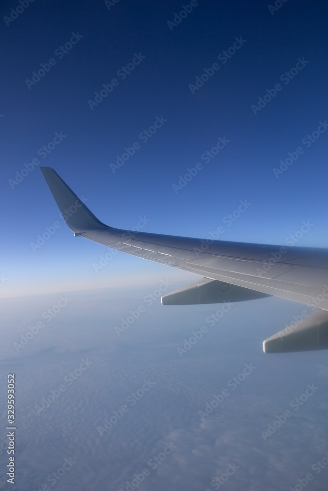 Airplane wing in the sky. View from a great height. Airplane wing in the sky. View from a great height.