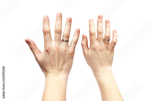 Hands on a white background. Male and female hand on a white background. Rings on the hands.