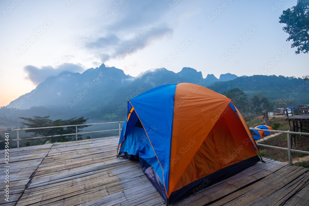 ฺBeautiful morning in the mountains and orange tent at district,Chiang Mai province thailand