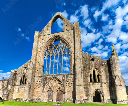 The ruins of Tintern Abbey, founded by Walter de Clare, Lord of Chepstow, on 9 May 1131. It is situated adjacent to the village of Tintern in Monmouthshire, Wales, UK. photo