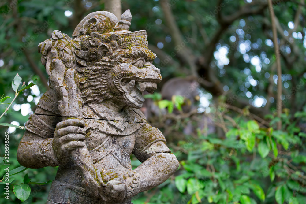 Traditional stone statues depicting demons, gods and Balinese mythological deities in Bali,Indonesia