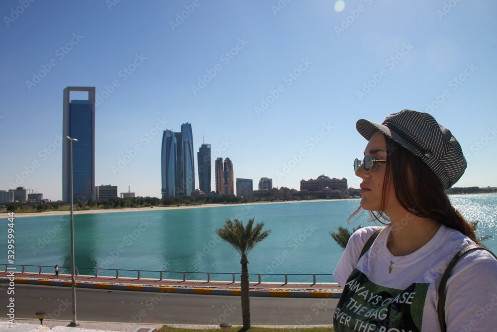 Woman with sunglasses enjoying a sunny day in Abu Dhabi