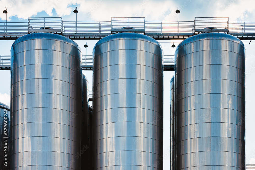 Beer production industry plant. Large amount of fermentation tanks. Beer production industry plant. Large amount of fermentation tanks.