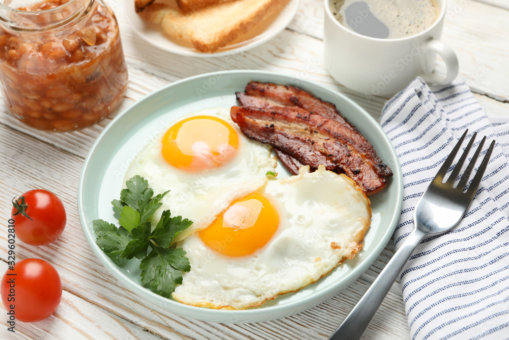 Delicious breakfast or lunch with fried eggs on wooden background, close up Delicious breakfast or lunch with fried eggs on wooden background, close up