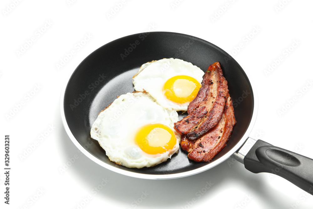 Pan with fried eggs and bacon isolated on white background Pan with fried eggs and bacon isolated on white background