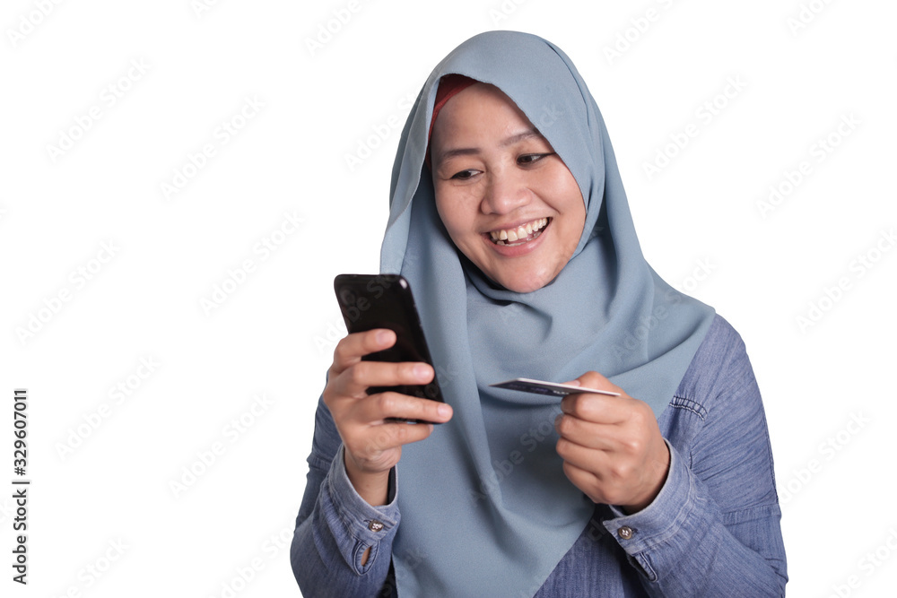 Muslim Woman Buying Online from Mobile Phone Concept Muslim Woman Buying Online from Mobile Phone Concept
