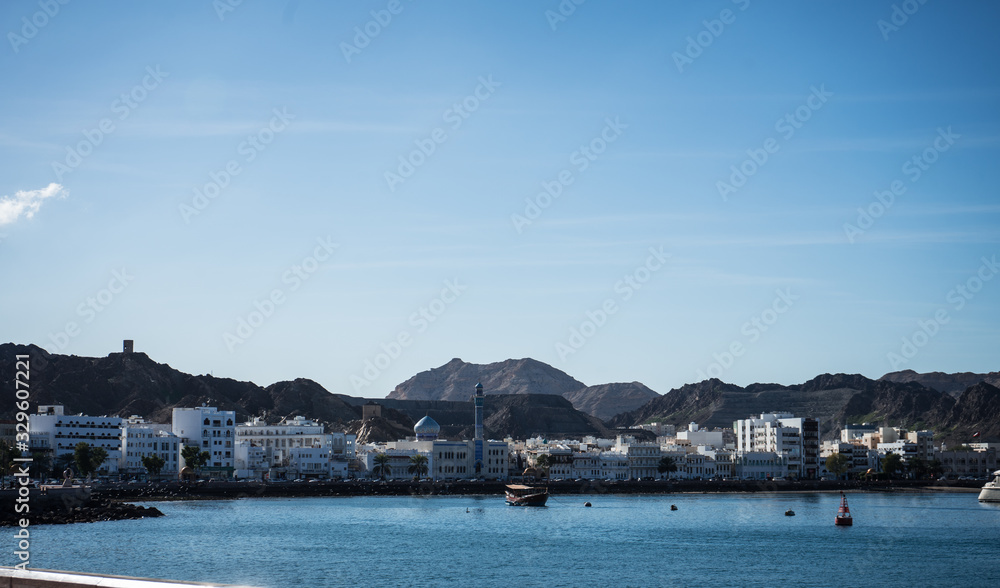 Sunny day in the Muscat bay with the Mutrah fort in the background, Oman