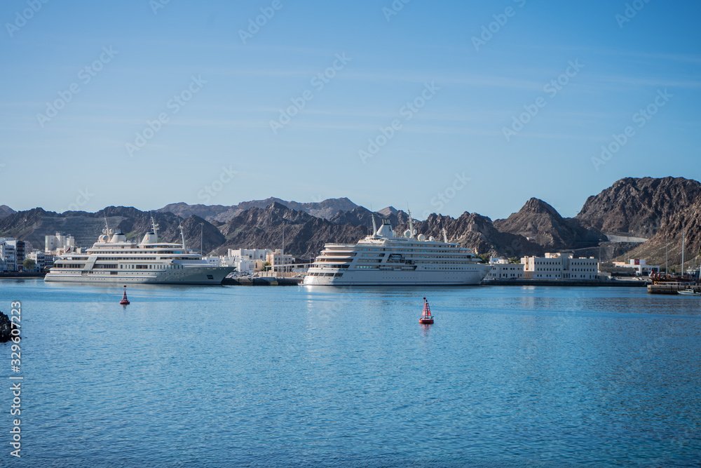 Naklejka premium Two yachts docked in the Muscat bay, Oman