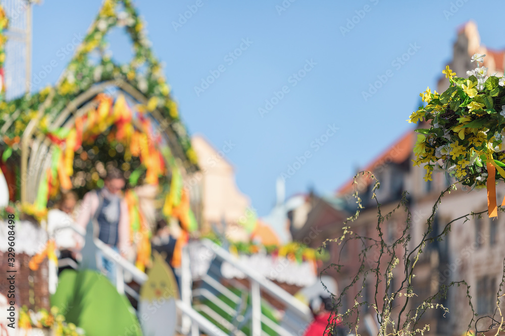 Blurred background of Easter market at the Old Town Square in Praguet, Czech republic, copy space