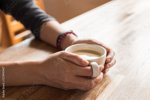 woman hold a cup a coffee