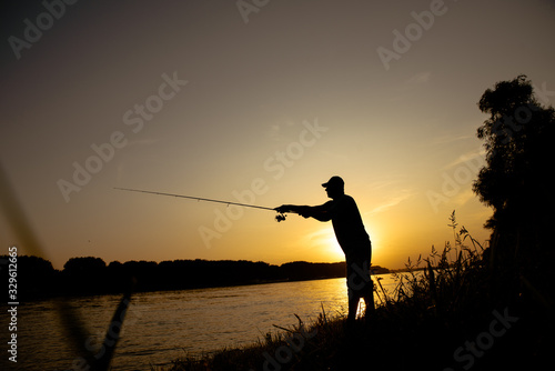 Men fishing on the river