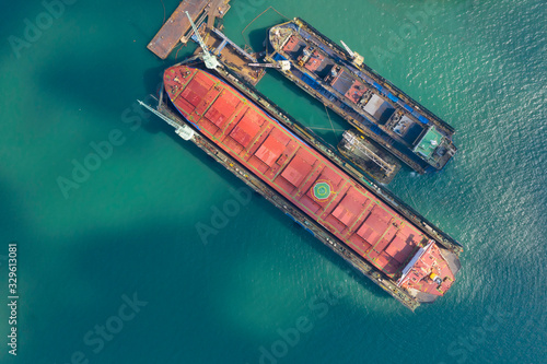 Aerial view shipyard at sea In the process of assembling a container ship. © MAGNIFIER