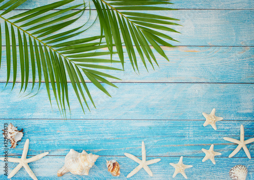 Summer beach background with palm leaves.