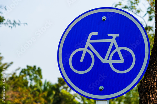 Close up bicycle lane sign in the garden
