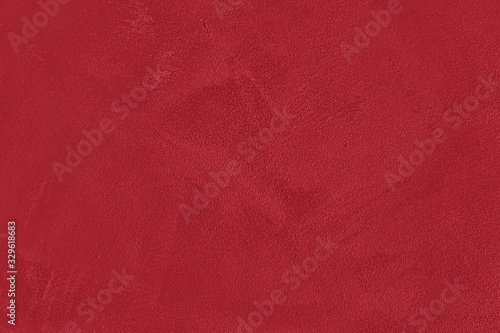 Modern Bright red low contrast concrete textured wall background, great design for any purposes. Stylish urban monochrome abstract backdrop. Winter color trend.