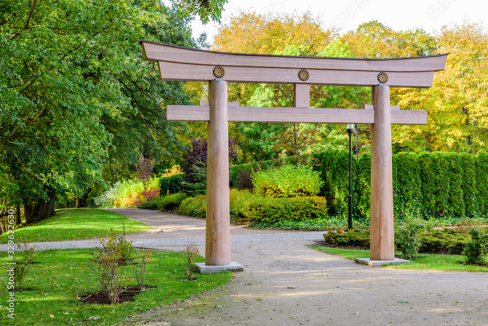 Sightseeing of Poland. Oliwa park - a picturesque Japanese-style city Park, Traditional japanese wooden Torii gate in Gdansk, Poland Sightseeing of Poland. Oliwa park - a picturesque Japanese-style city Park, Traditional japanese wooden Torii gate in Gdansk, Poland