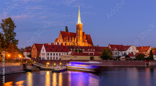 Sightseeing of Poland. Cityscape of Wroclaw, beautiful night view. The view at Tumski island and Cathedral of St John the Baptist, Church of Our lady on the Sand, Odra river.