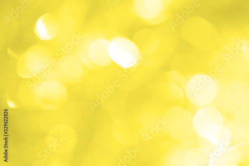 Yellow brilliant background with splits and glare for New Year's greeting card. Wallpapers for various purposes.