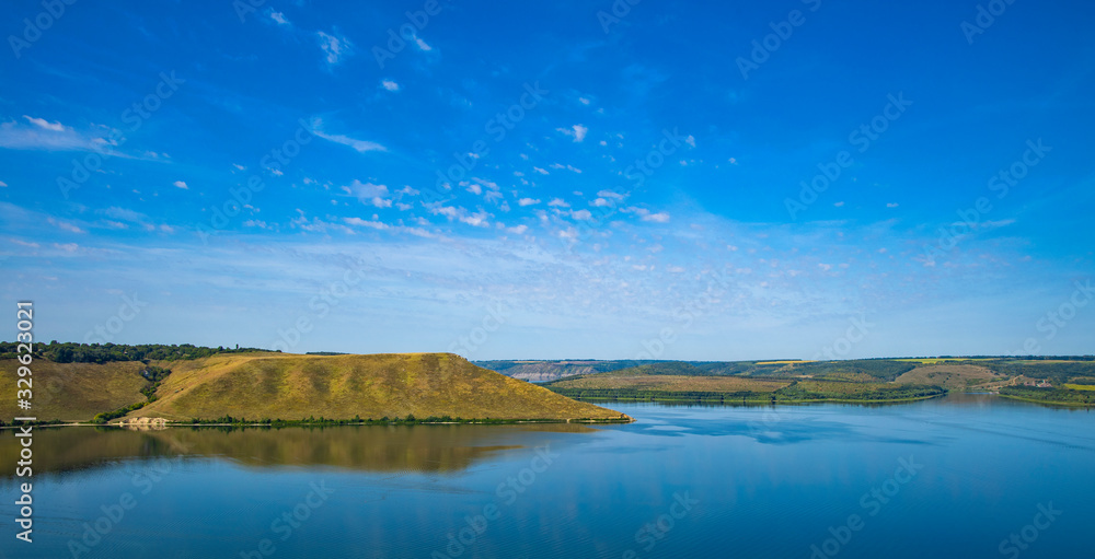 panoramic picturesque summer nature landscape travel photography vivid colorful green yellow hill land country side space near Ukrainian Dniester river coast line blue water