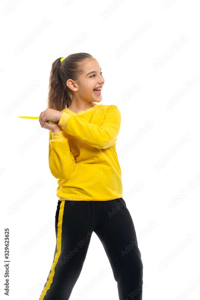 A young girl throwing a tennis racket, isolated A young girl throwing a tennis racket, isolated