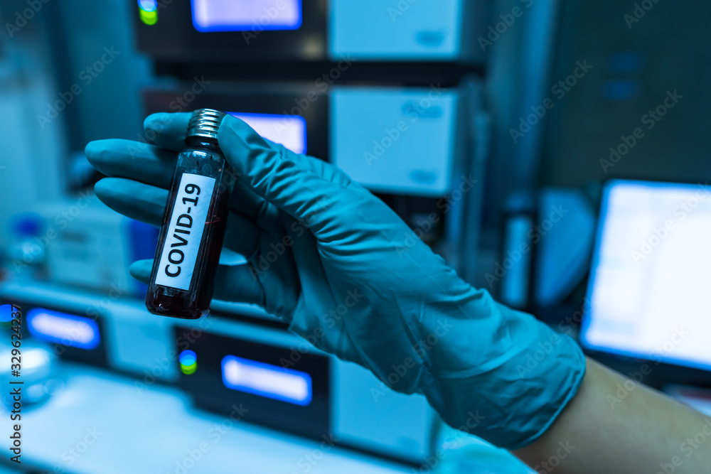 Scientist holding Test tube with blood sample for COVID-19 test,Experiment to detect virus was found in the blood. Scientist holding Test tube with blood sample for COVID-19 test,Experiment to detect virus was found in the blood.