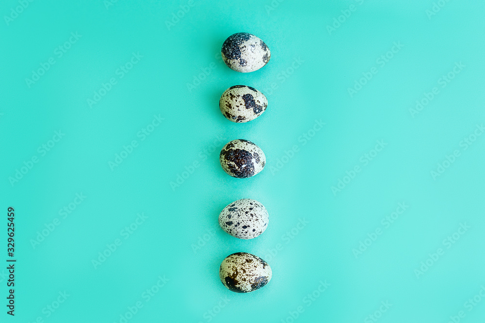 Quail eggs on a mint background Fresh quail eggs background. Natural healthy food and organic concept Easter concept Quail eggs on a mint background Fresh quail eggs background. Natural healthy food and organic concept Easter concept