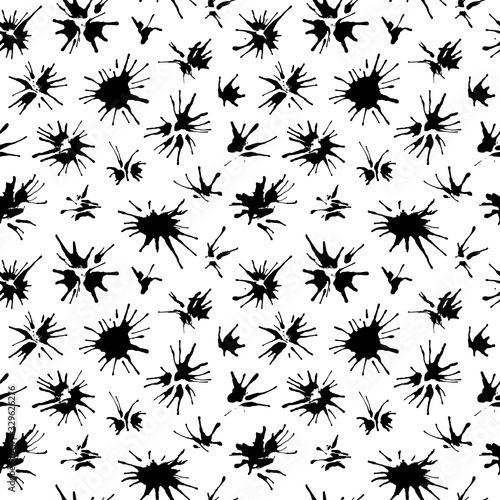 Ink splashes seamless pattern. Black artistic spots, splashes, blots on a white background.