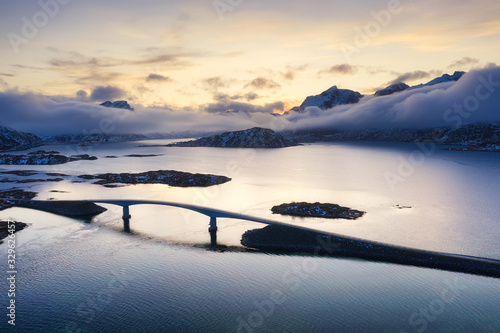 View from the air on the bridge and mountains during sunset. Lofoten Islands,...