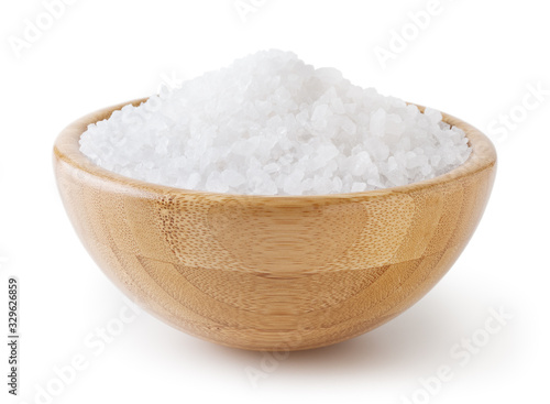 Sea salt in wooden bowl isolated on white background with clipping path photo