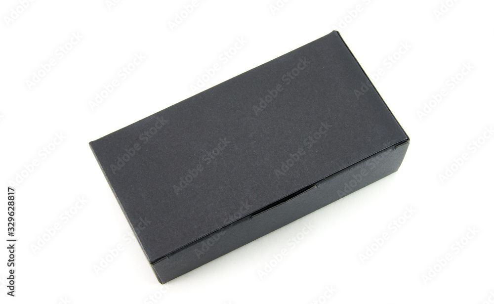 Matte black, rectangular, paper box on white isolated background. Cardboard package. Matte black, rectangular, paper box on white isolated background. Cardboard package.