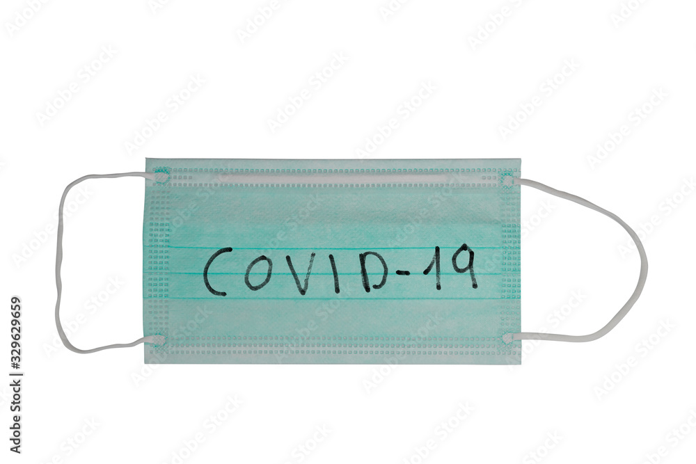 Surgical mask with rubber ear straps. Typical 3-ply surgical mask to cover the mouth and nose with the text COVID-19 Surgical mask with rubber ear straps. Typical 3-ply surgical mask to cover the mouth and nose with the text COVID-19